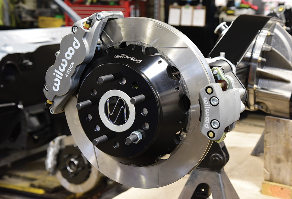 Closeup of completed install of the new Wilwood Forged Narrow Superlite 4R Big Brake Rear Electronic Parking Brake kit