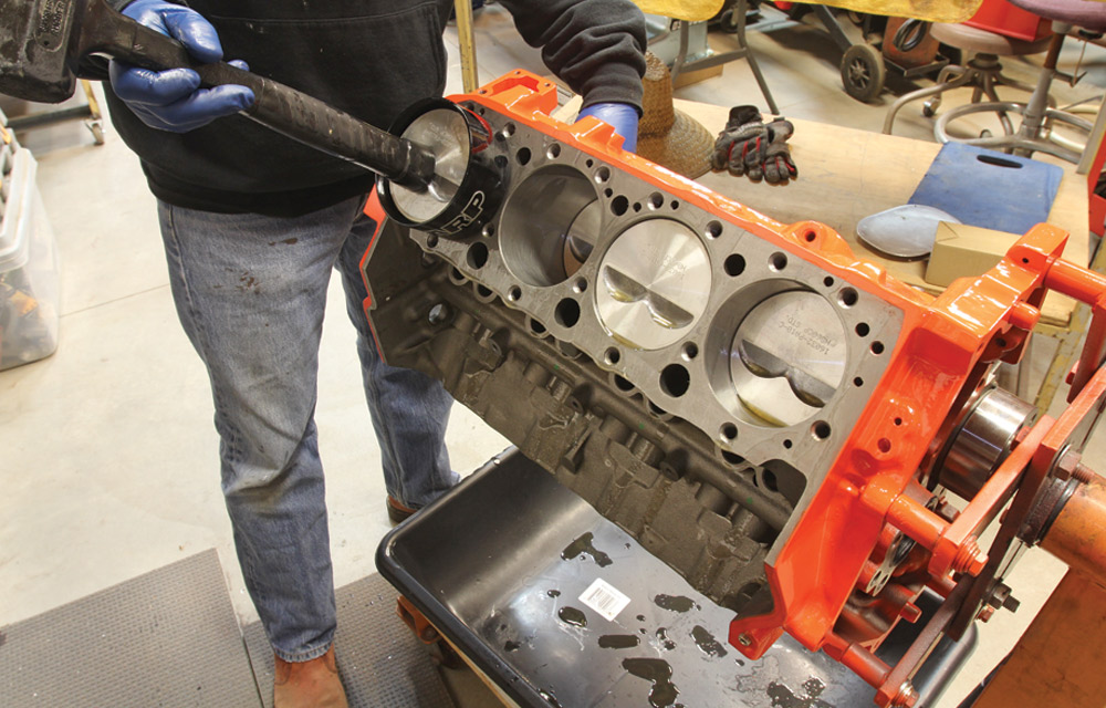 mechanic uses ARP unit, a piston installation tool