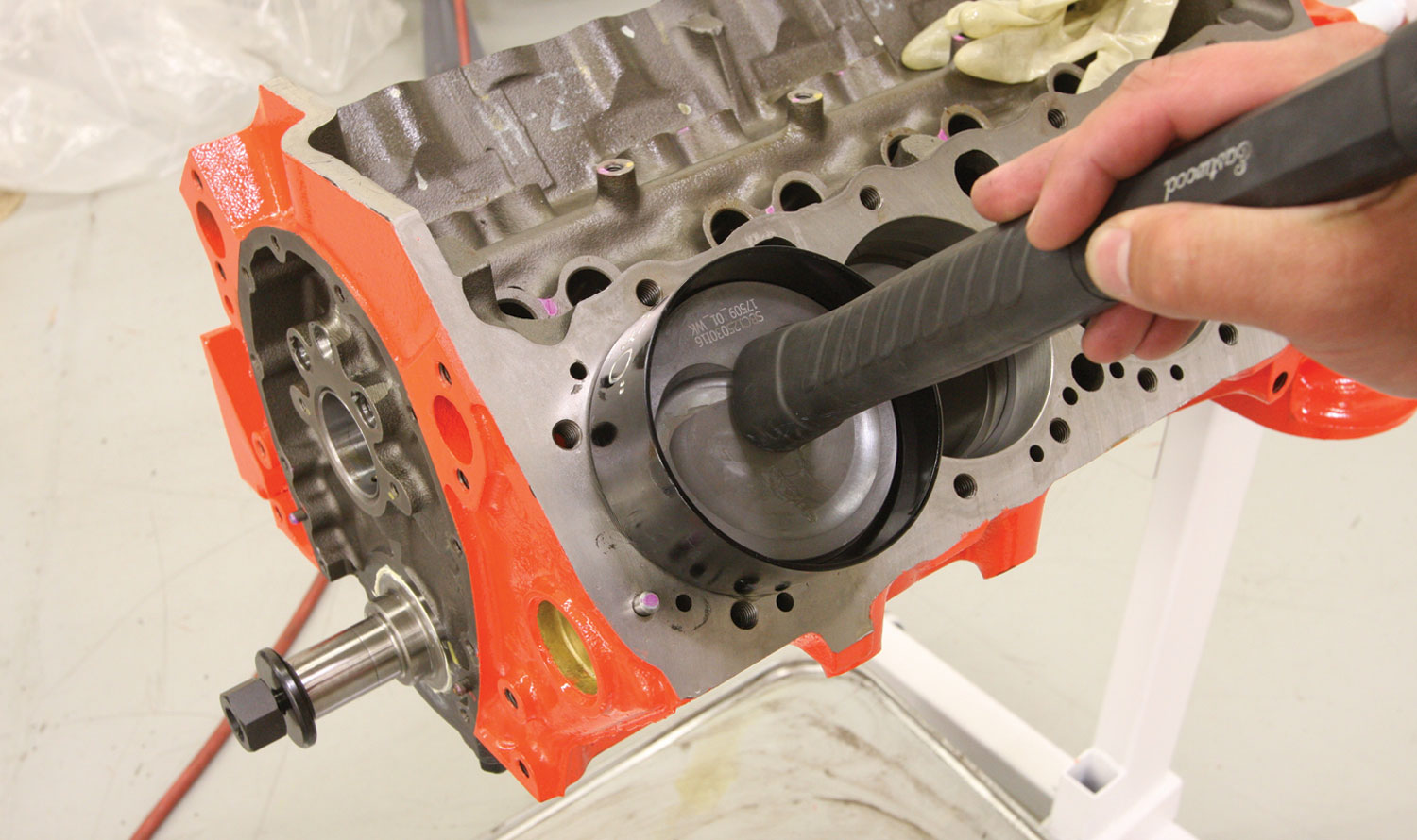 mechanic measures engine component