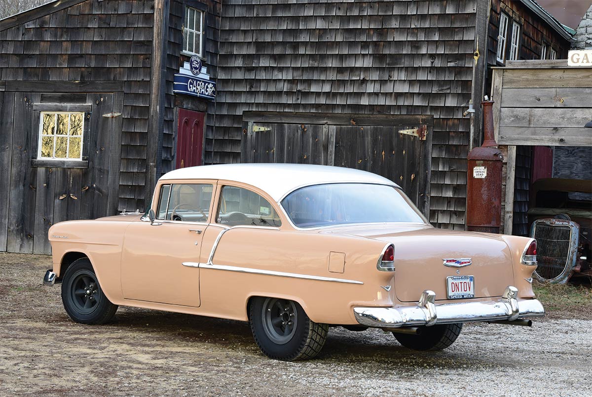 1955 chevy 210 rear view with wooden building in background