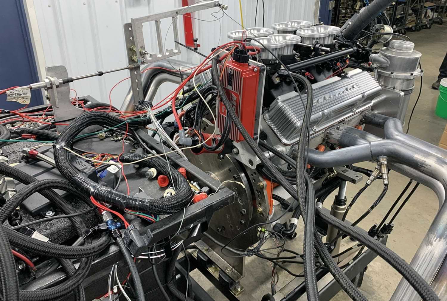 view of block engine with various wires, valves and tubing connected