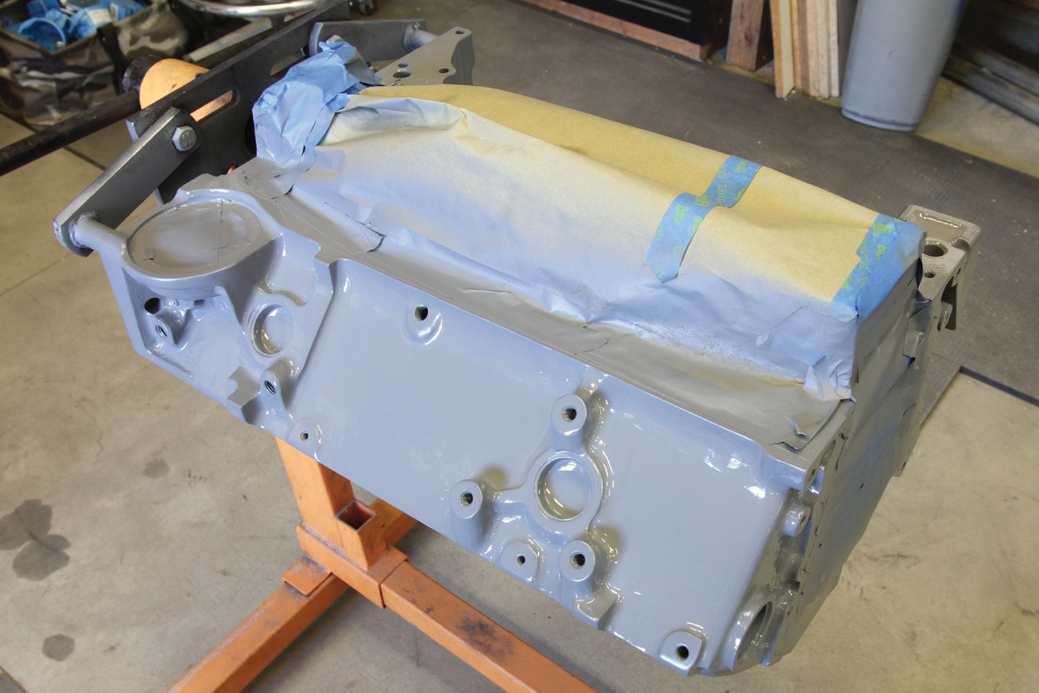 engine block with all exposed holes covered in preparation for painting