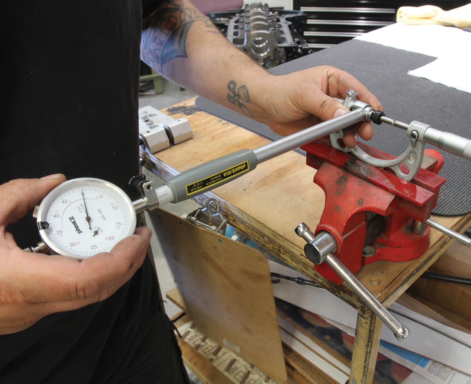 mechanic uses the dial bore gauge with the outside micrometer