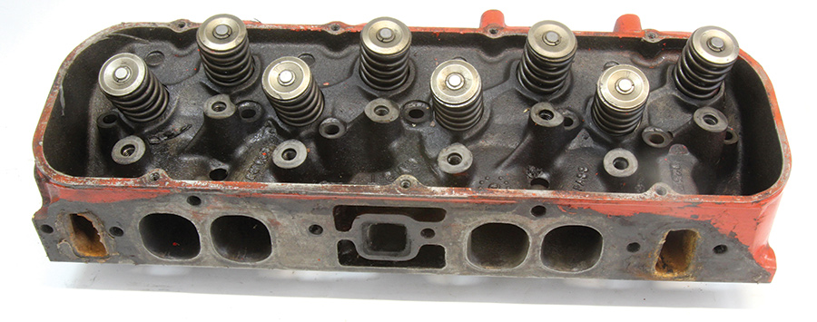 an early set of cast-iron, oval-port, closed-chamber heads from Chevrolet