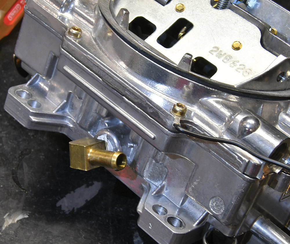 Closeup of the the rear port of the carb
