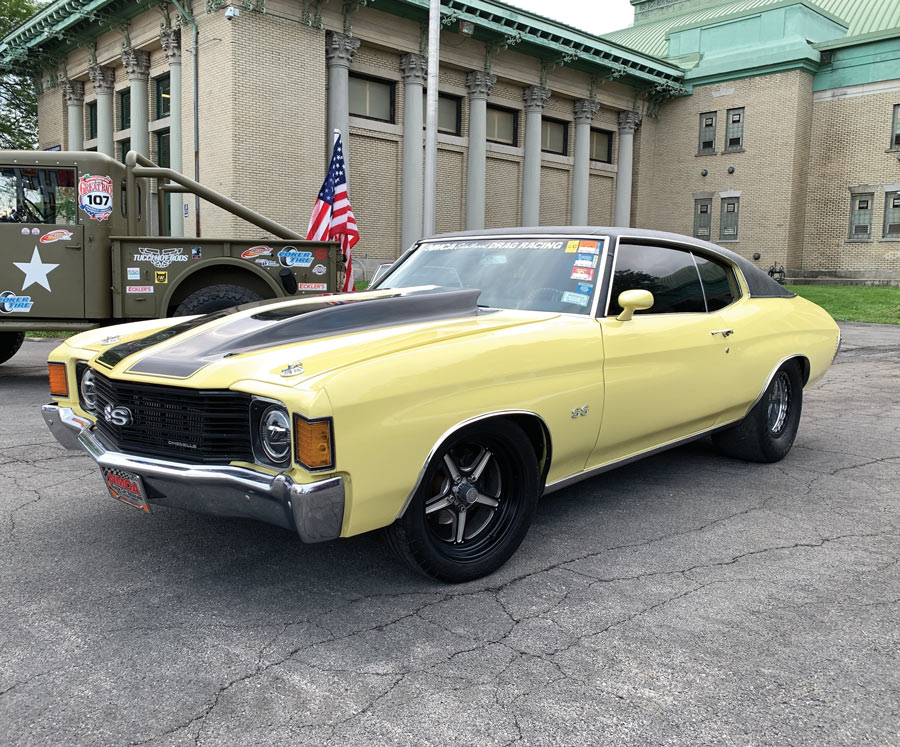 light yellow car with black racing stripes