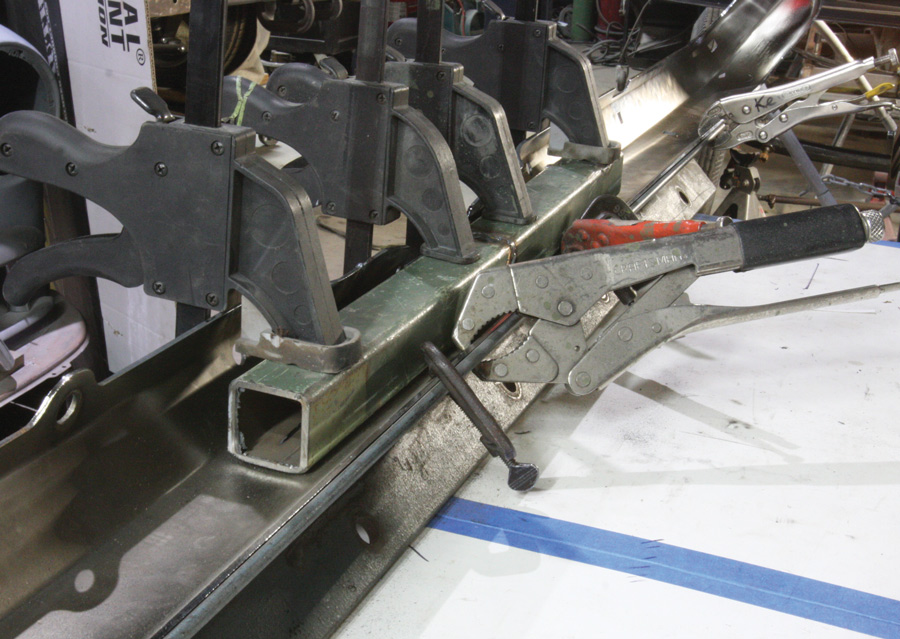 Two 1 5/8-inch strips were cut from the bumper, 4 inches either side of the centerline