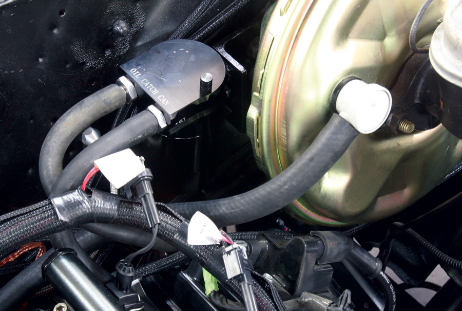 Here’s the catch can mounted behind the power brake booster where it all but disappears