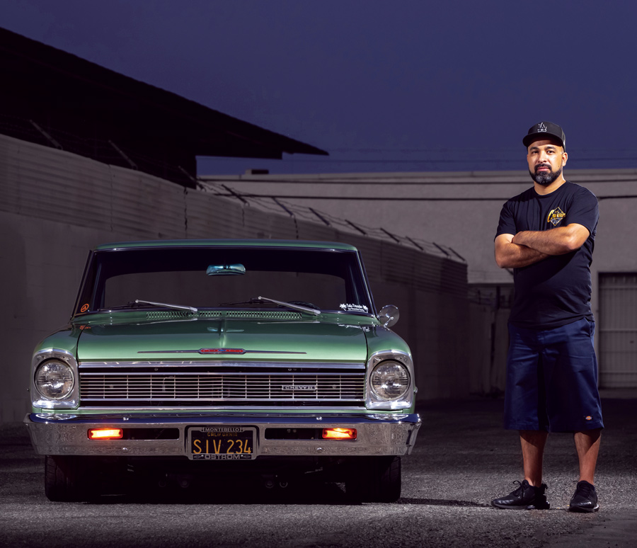man standing with his 1966 Chevy II Nova