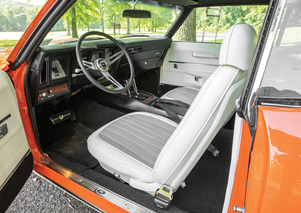 orange '69 Camaro interior view of white seats