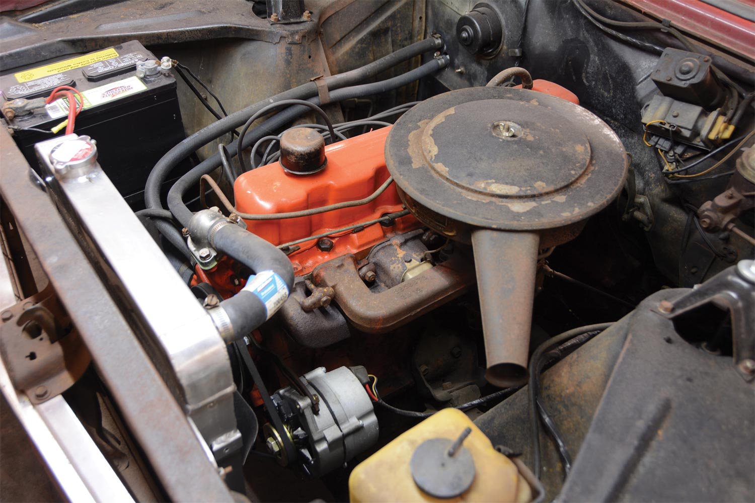 a stock ’66 Chevy II with its original 194ci inline six-cylinder engine inside a car