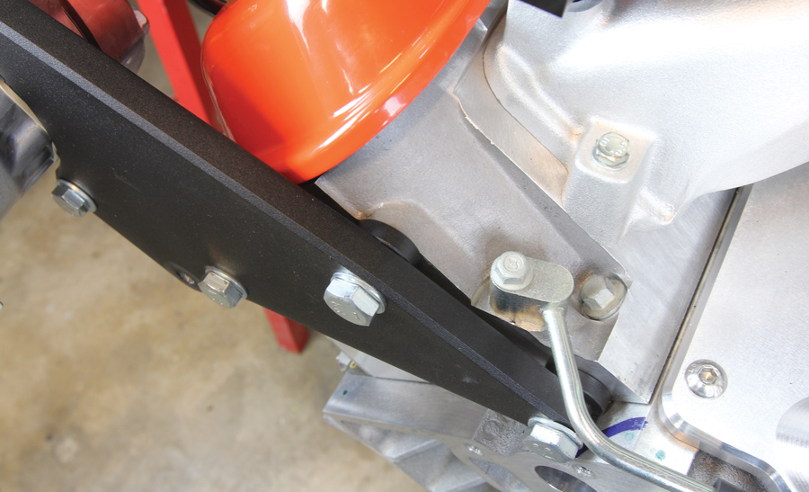 the rear passenger side bracket bolted directly to the stock holes in the end of the heads, using spacers to ensure the brackets clear the valve covers