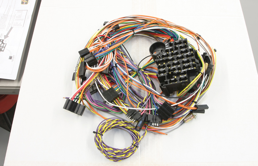 This Classic Update harness uses an integrated fuse block (the wires are already attached) that mounts in the factory location. Having the wires attached eliminates the difficulty of making connections under the dash.