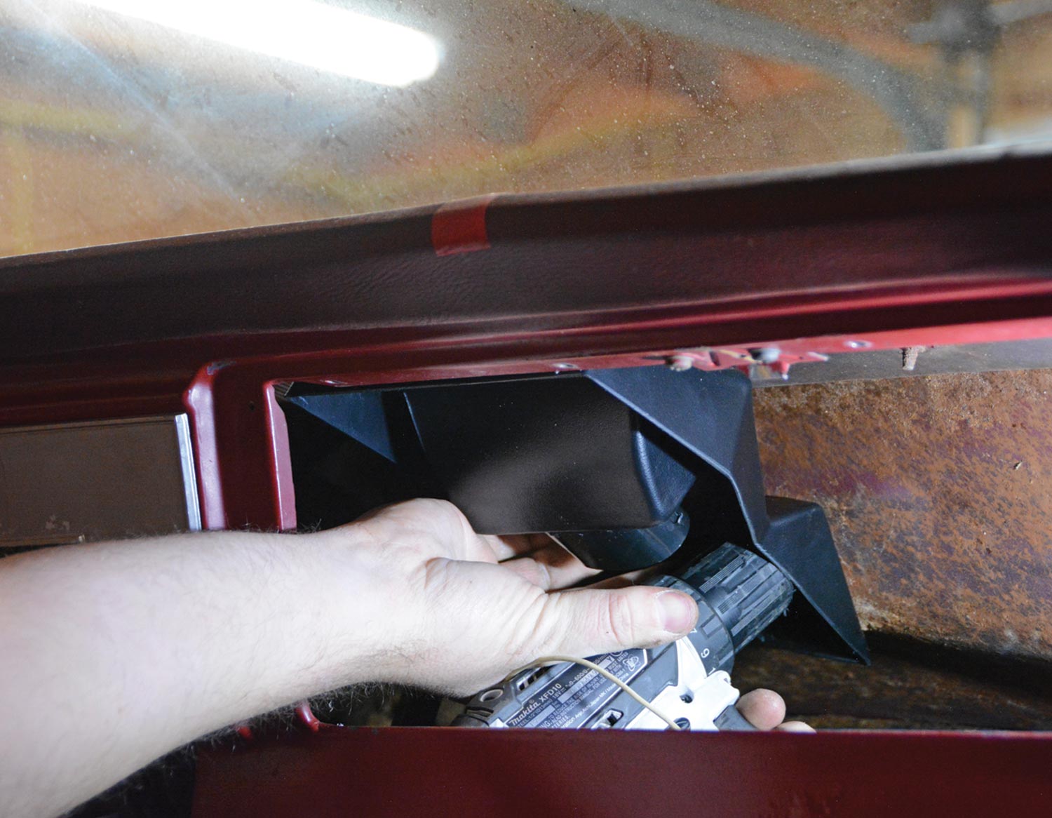 before sliding the evaporator into place the mechanic installs the defrost ducts