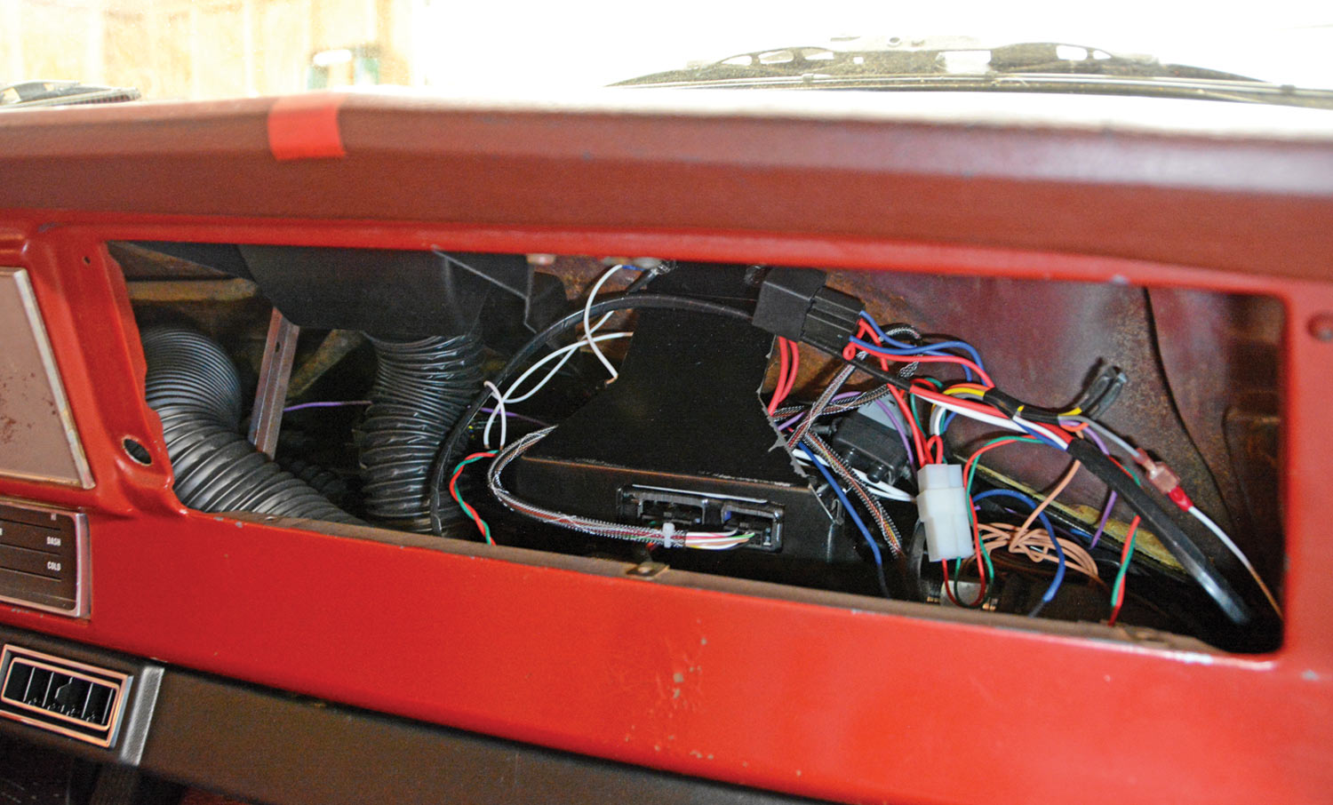 view of the wiring connections before the glove box door is reinstalled