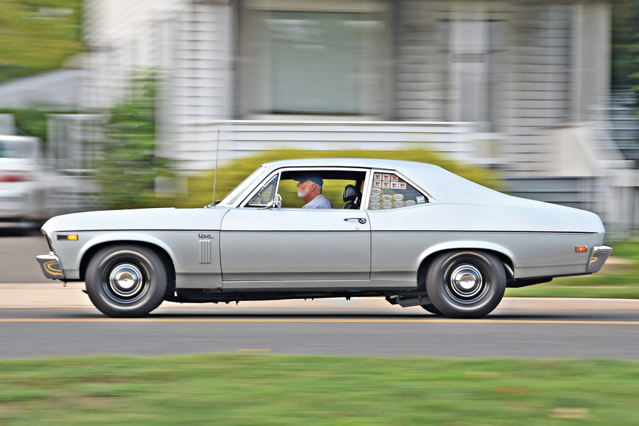man driving ’69 Chevy Nova