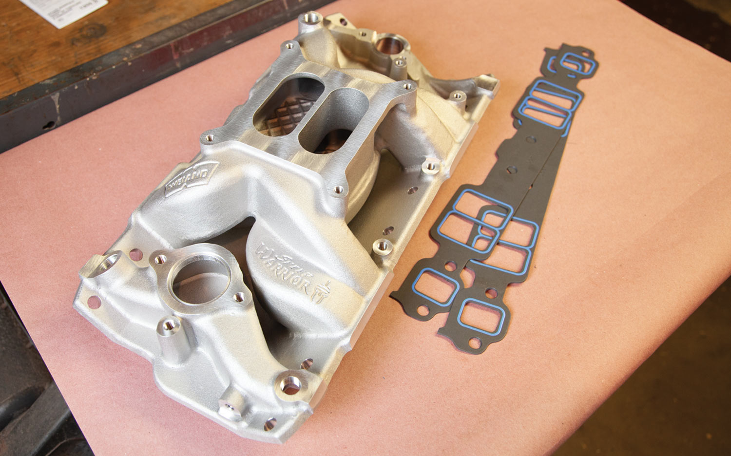 a high rise/dual plane Weiand Speed Warrior intake (PN 8501WND) along with a set of Fel-Pro’s intake gaskets (PN 1205)