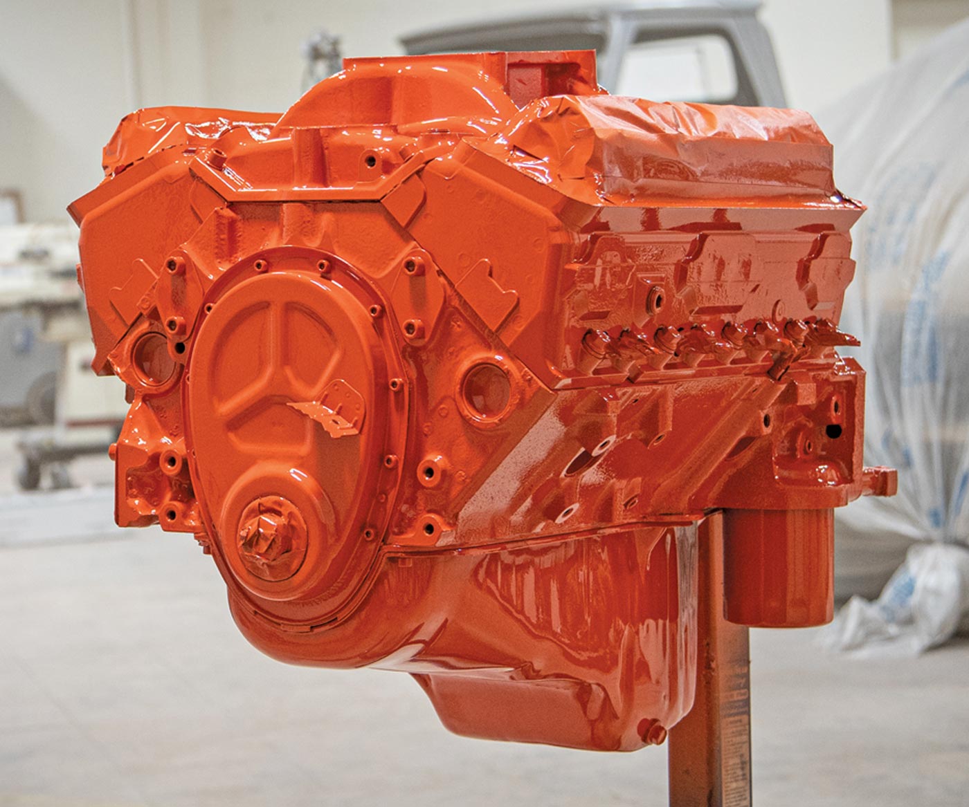 view of the engine covered with three heavy coats of single-stage Chevy Orange