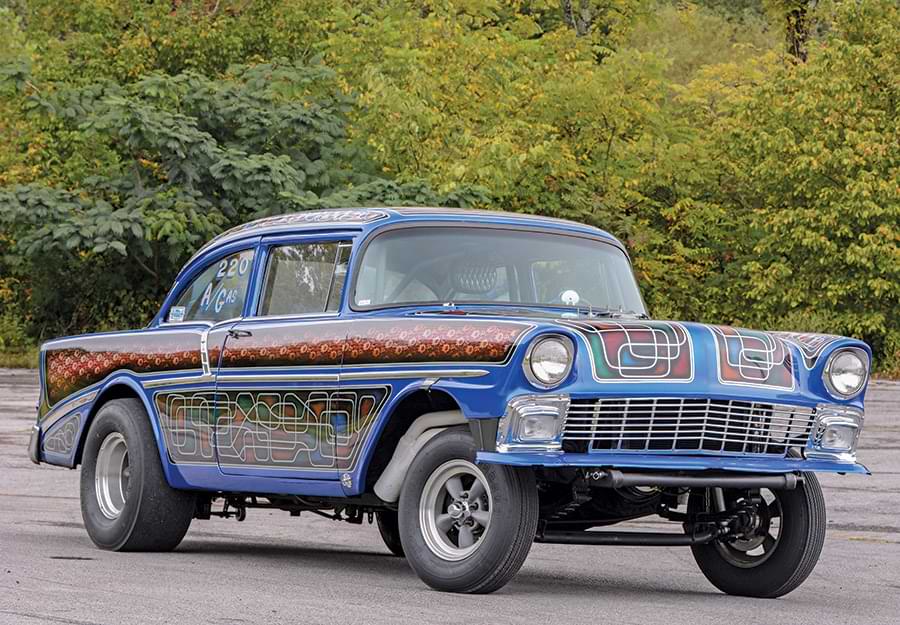 A photograph of a blue 1957 Chevy Gasser parked