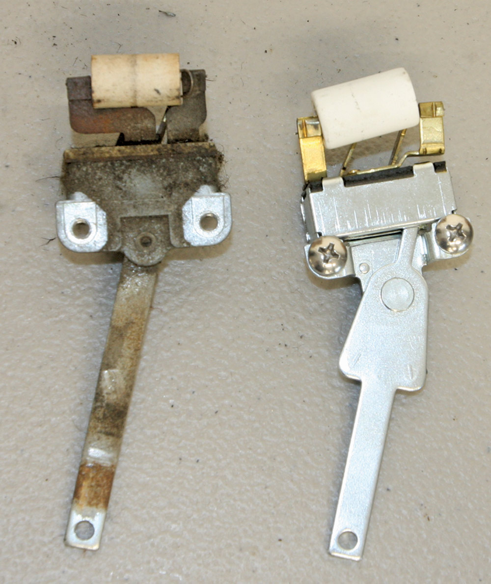 the original heater blower switch placed next to the new unit from Danchuk for comparison