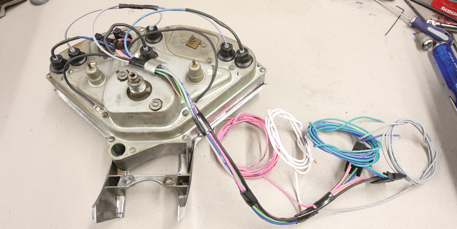back view of the gauge with multiple colored wires connected