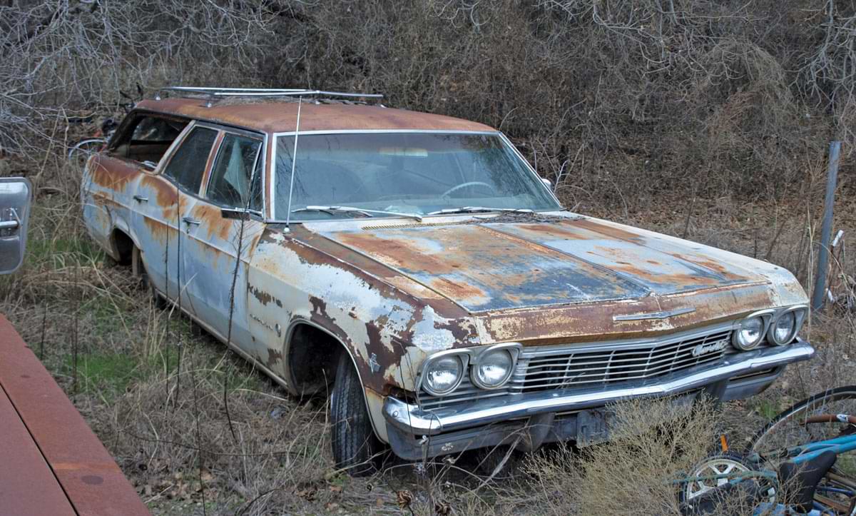 Cars like this ’65 Impala wagon make the most of the width-enhancing aspect of quad headlamps