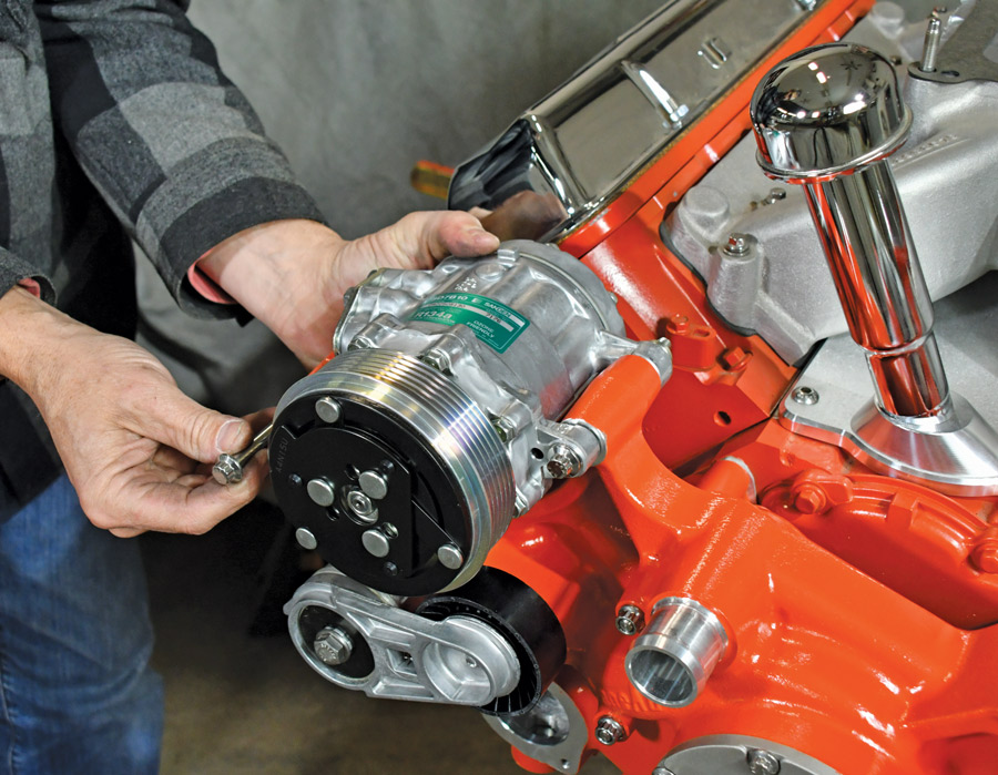 Like the alternator, the new Sanden compressor is held in place by two long bolts with Nyloc nuts for a secure fit. 