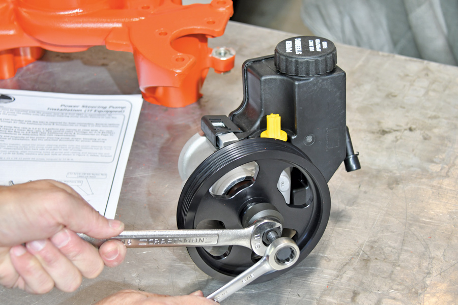 We rented a power steering pump pulley installation tool and wrenched the new billet pulley onto the Detroit Speed–sourced power steering pump. 