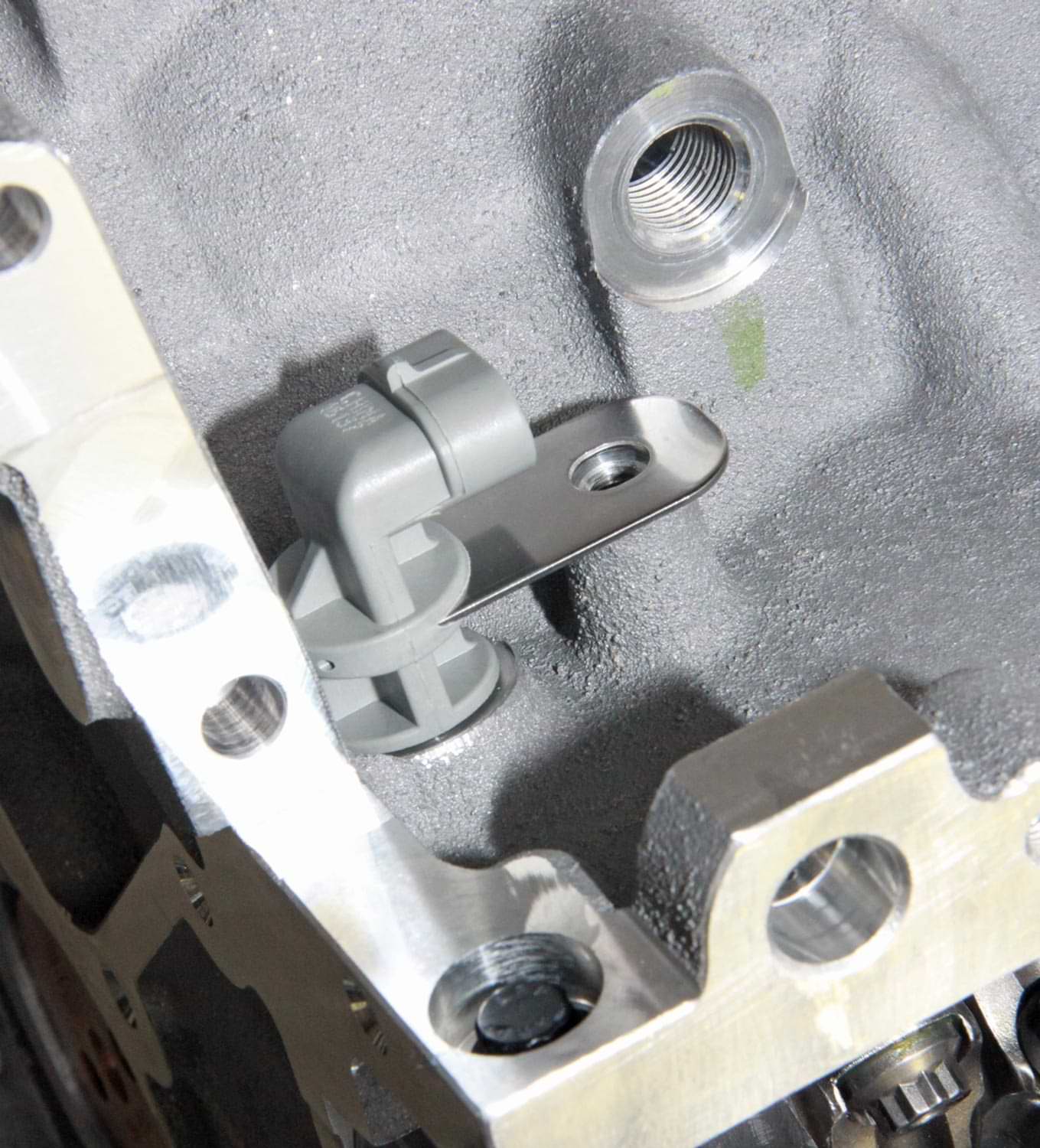 the Crankshaft Position Sensor located on the passenger side rear of LS engine blocks