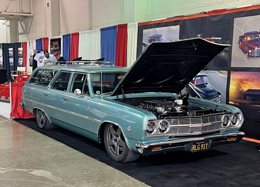 Cyan car with hood open