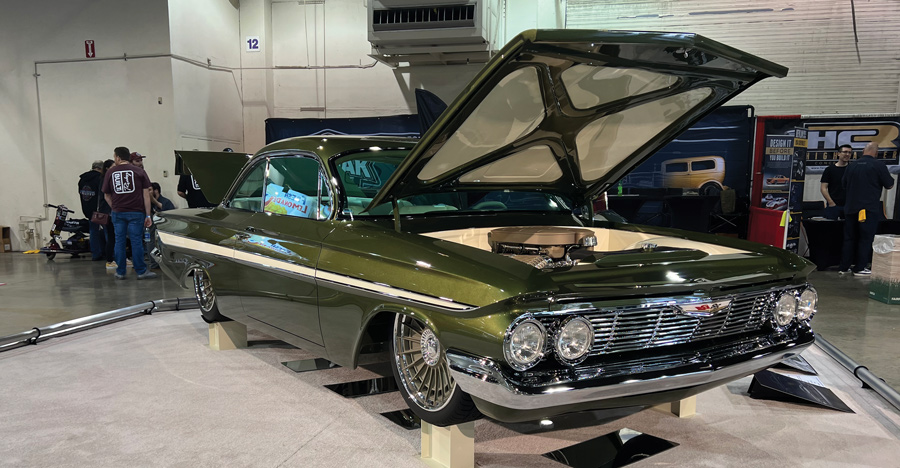 Green car with hood open