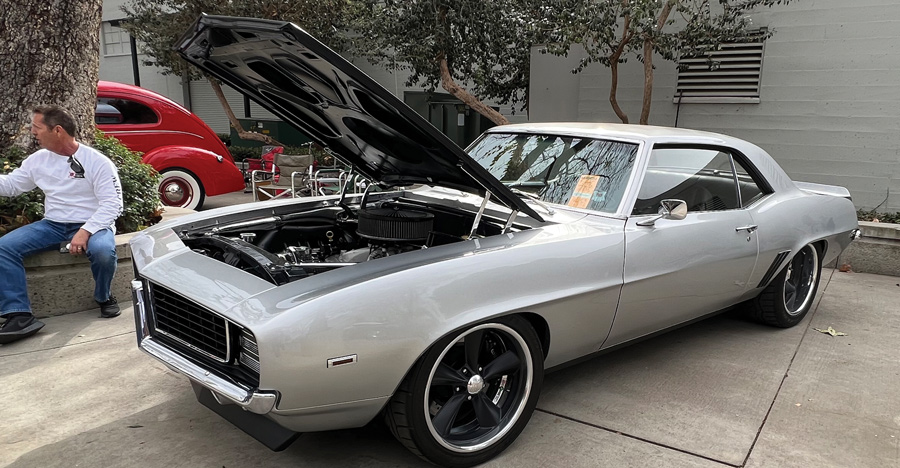 Light gray car with hood open