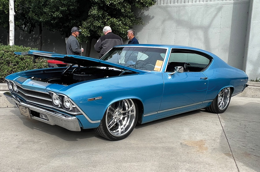 Blue car with semi-open hood