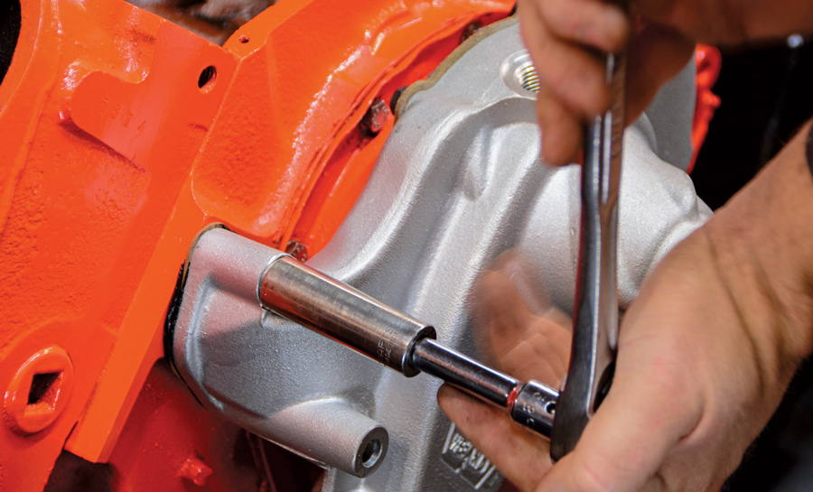  After applying RTV to the gasket surfaces, we install an aluminum water pump. Once again, this upgrade is twofold: it performs much better than a stock unit and it also adds some texture and color contrast to our engine bay.