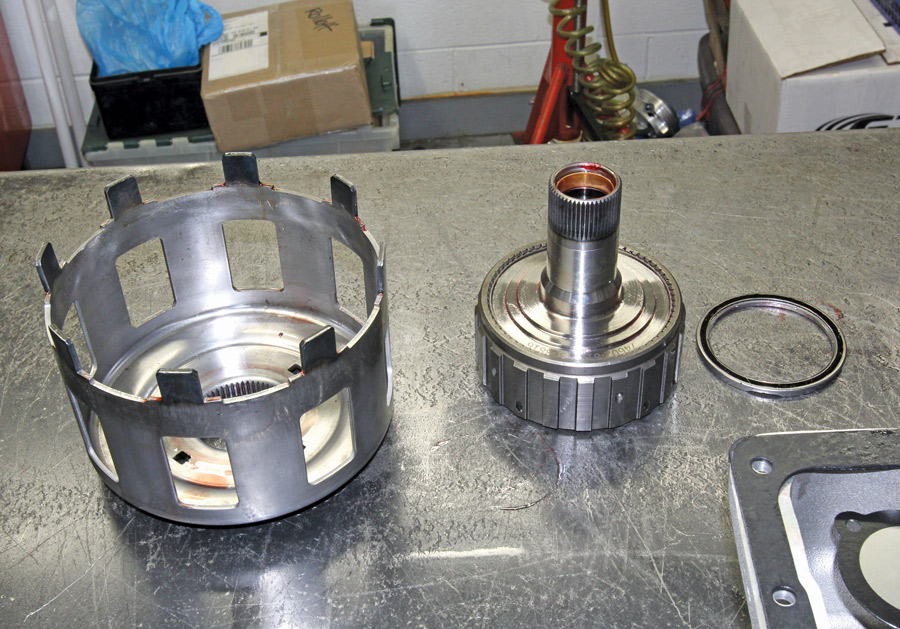 One area where both the 700-R4 and 4L60E have problems is the reaction shaft shell (left) that cracks around the center spline area. The improved Sonnax SmartShell (shown) is redesigned to spread the load and increase its strength to prevent these cracks. This is generally combined with a heavy-duty reaction shaft and bearing (right) that is stronger to prevent spline damage.