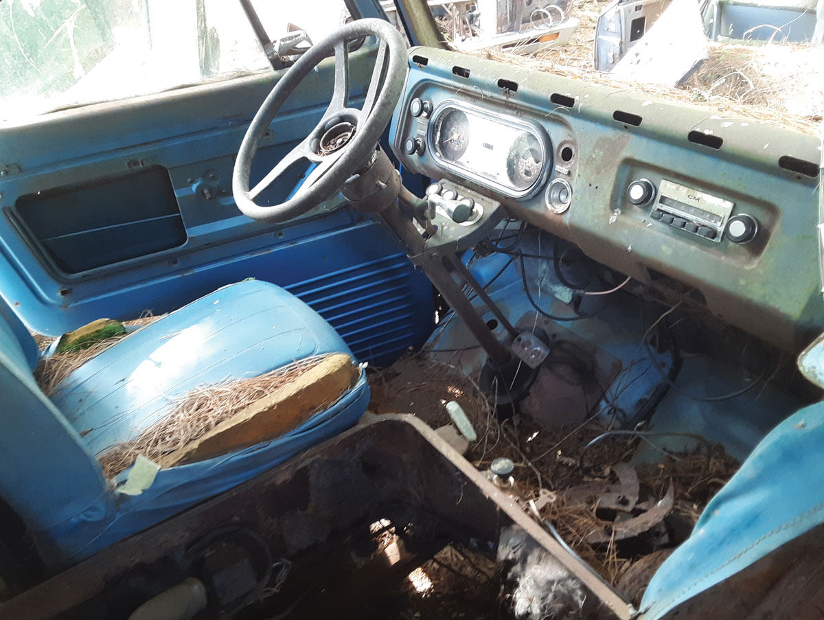 The nifty color-coded interior may seem as bare as a prison cell to modern drivers used to steering wheels with integral airbags and soft-touch surfaces everywhere