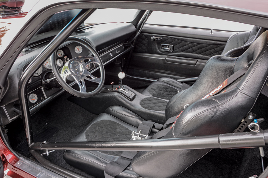 red '71 Camaro interior dashboard and steering wheel