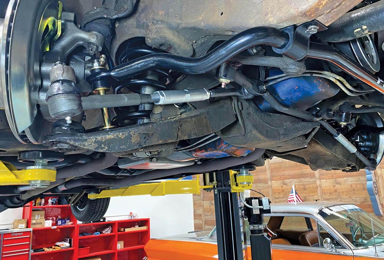 underside view of the lifted car, showing the new sway bar in place
