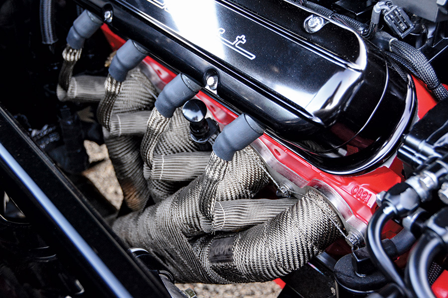 black '69 Camaro engine pipes closeup