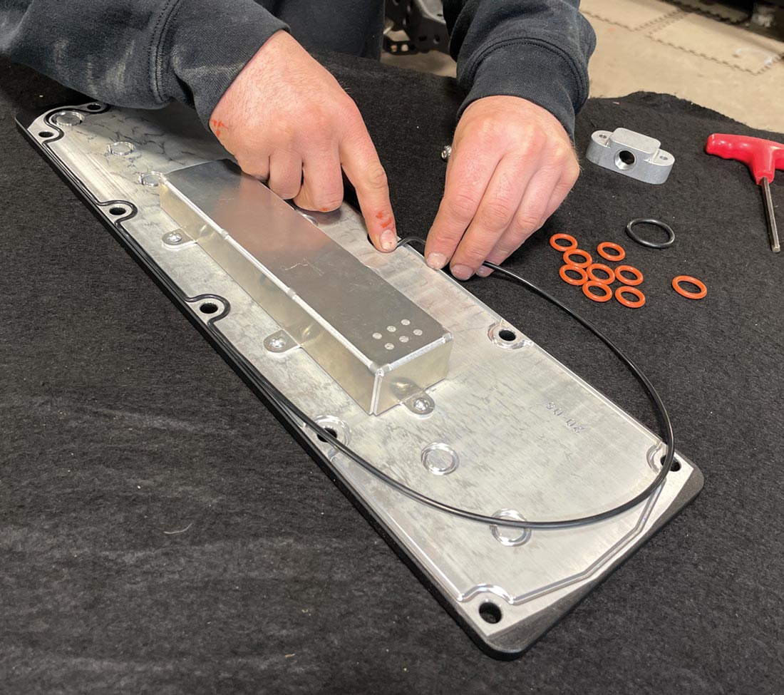 mechanic installs the supplied valley plate gasket along with the O-rings (two sizes) in the respective areas on the LS Classic Series Gen IV Breather Valley Plate