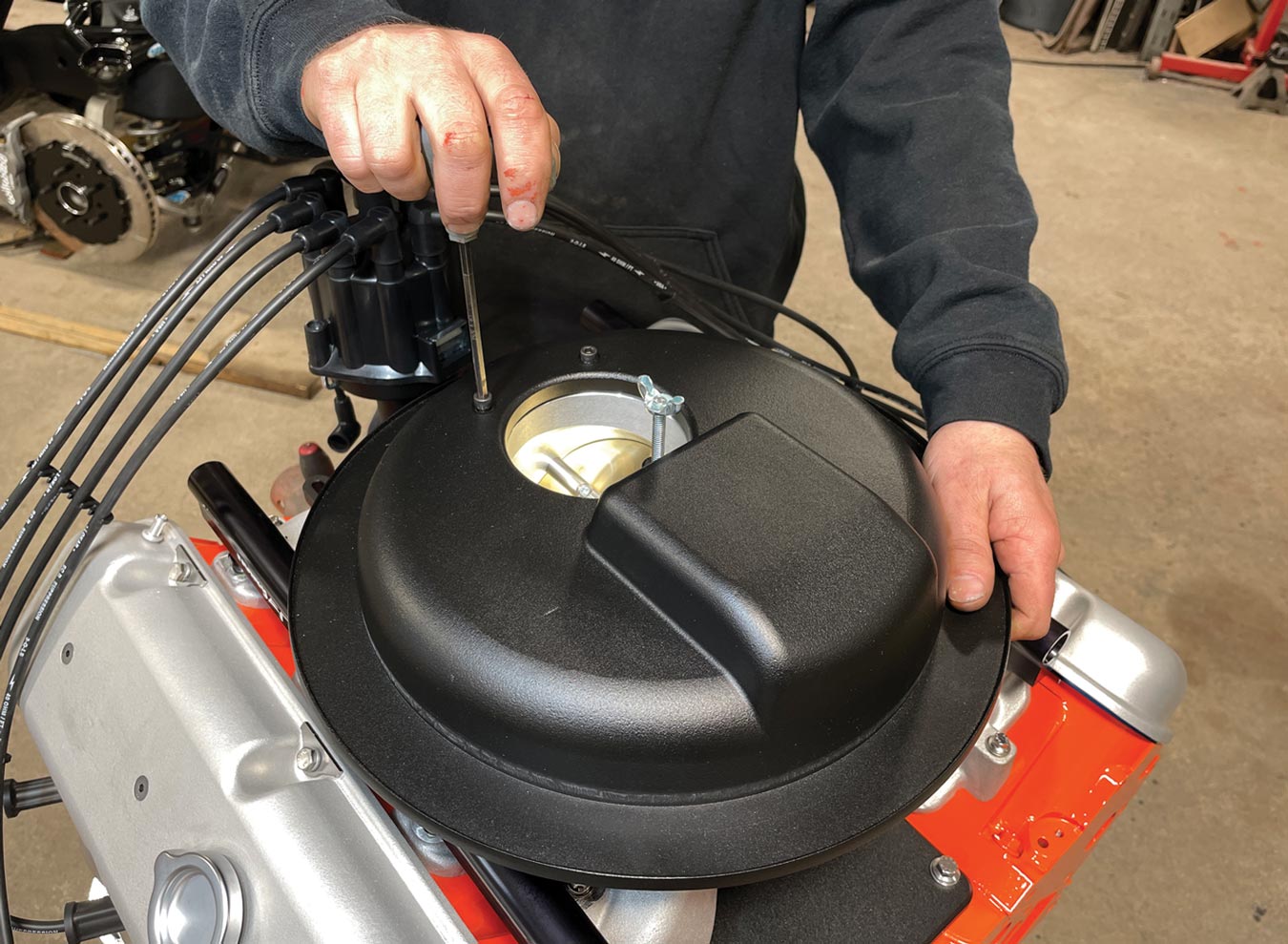 mechanic installs the Granatelli Motor Sports 103mm throttle body