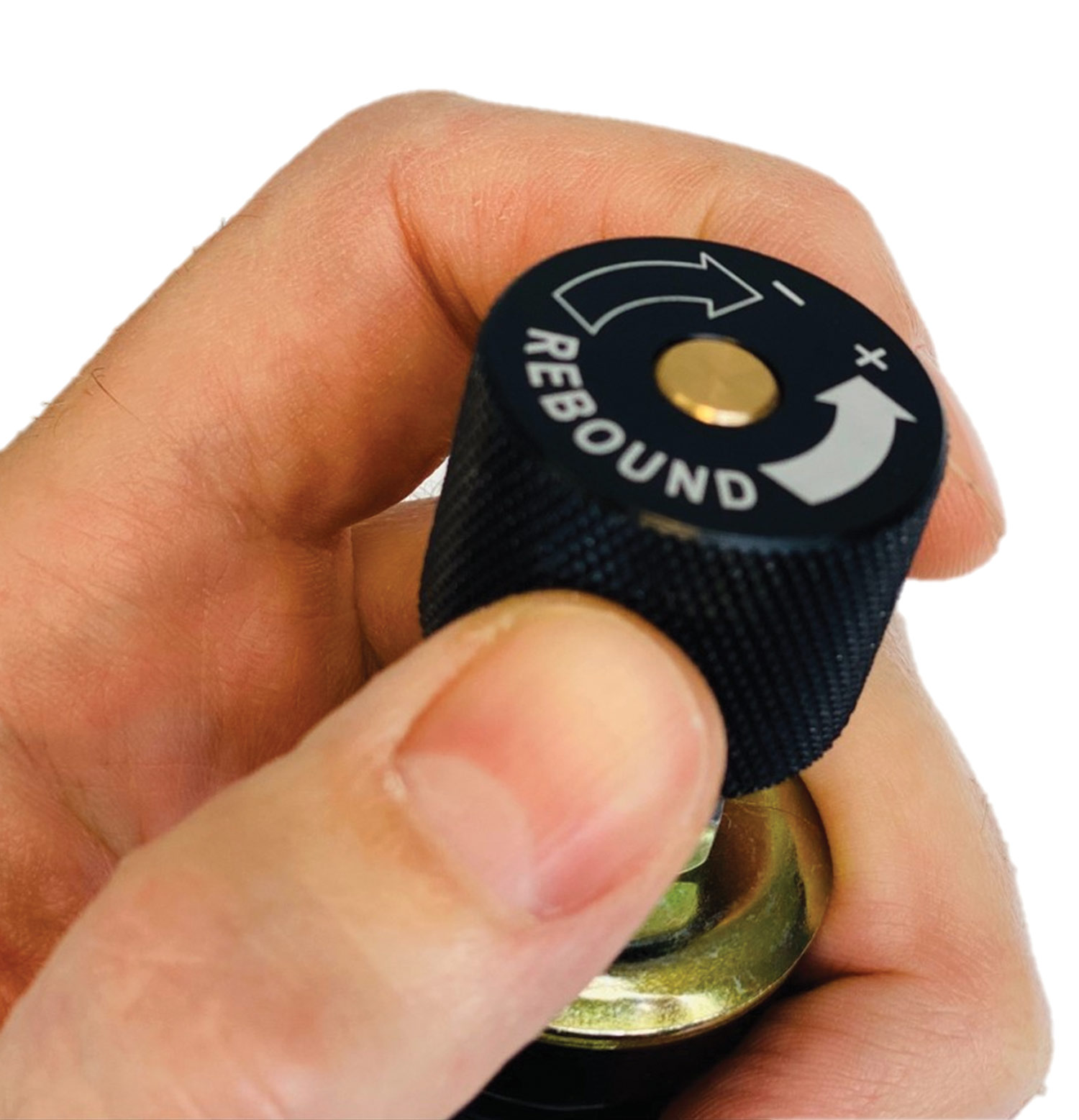 a hand turns a knob labeled "Rebound" at the base of Aldan American's double-adjustable RCX shock