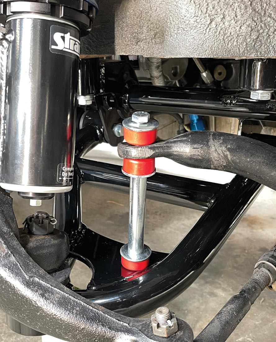view of the newly installed Heidts sway bar links with red Polyurethane bushings