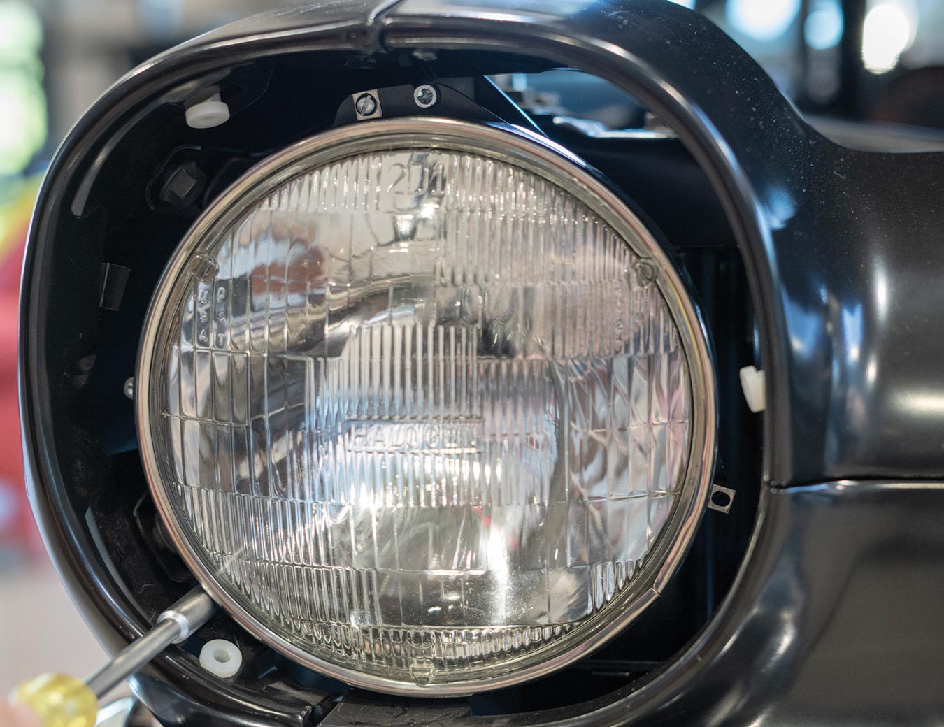 the headlight housing with the headlight bucket and the 7-inch halogen bulb installed