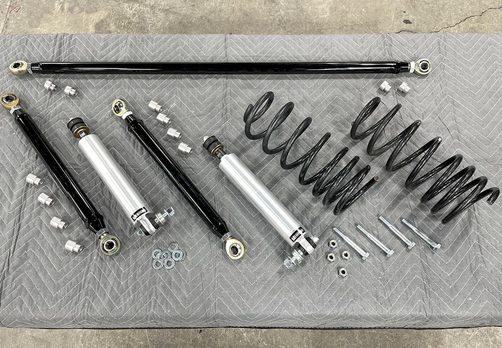various Heidts rear suspension components sit organized on a work surface