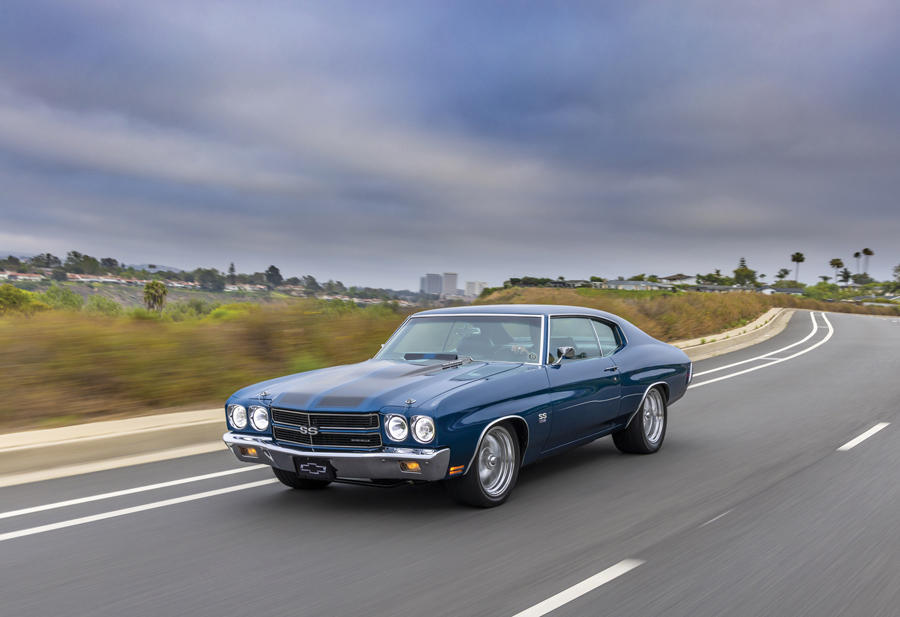 blue '70 Chevelle driving on the highway
