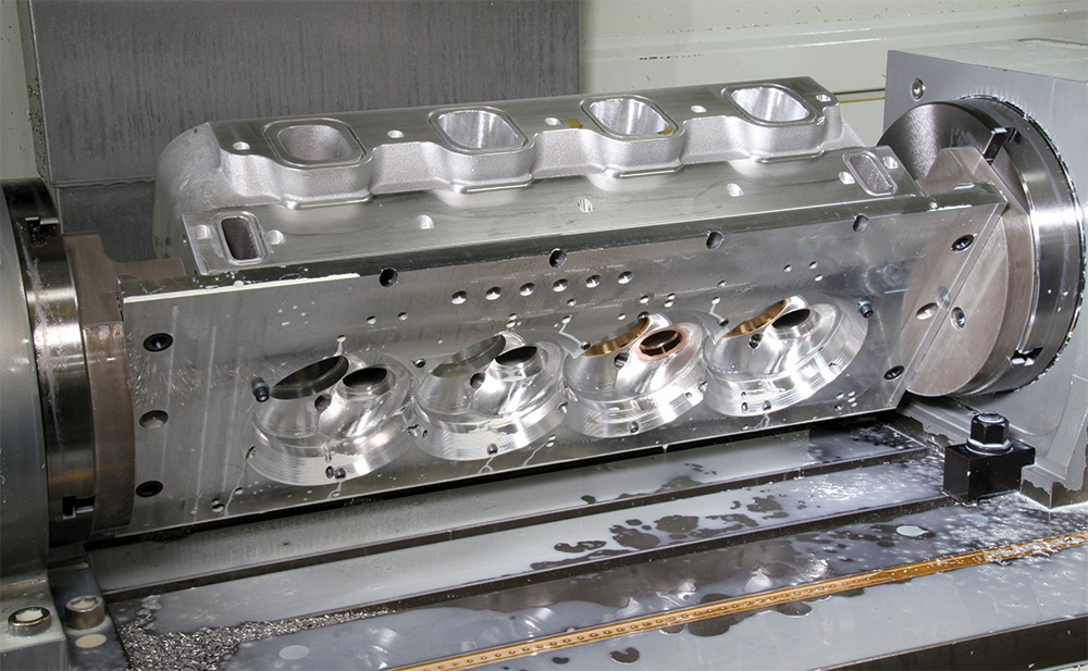 RS-X cylinder head in process of being CNC-machined from 356T aluminum alloy ingot