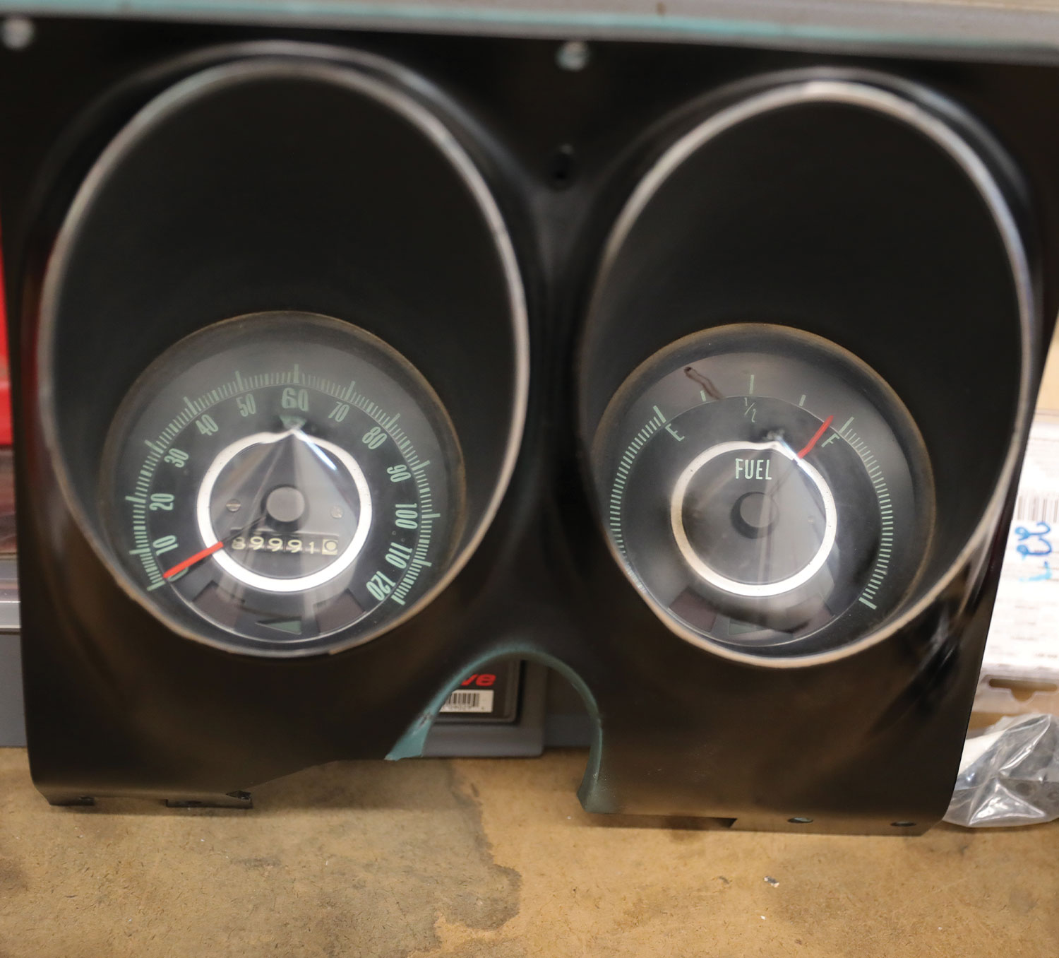 the old, removed factory gauges reading only speed and fuel level