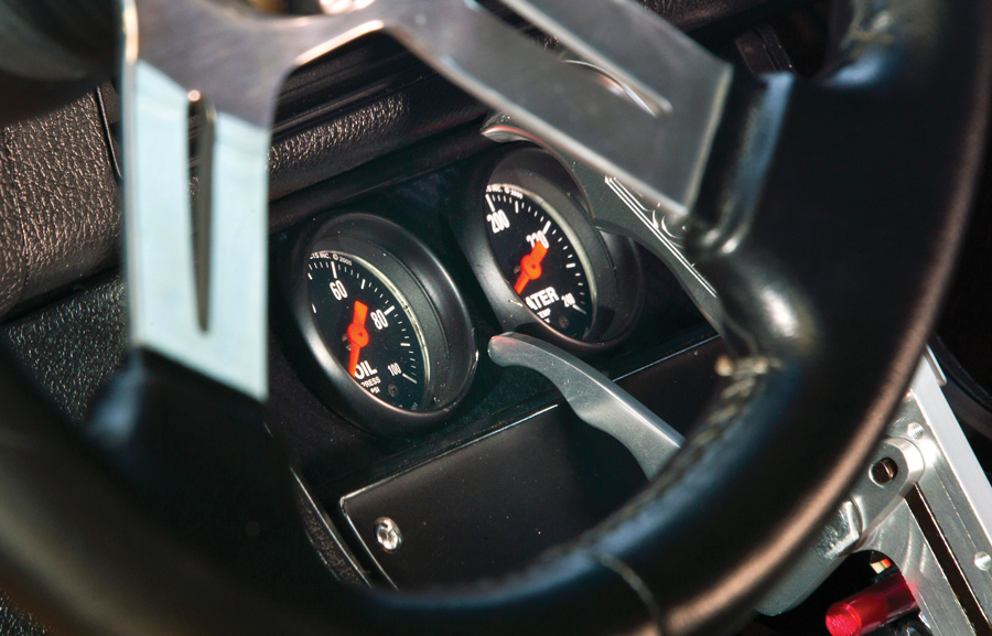close up of steering wheel and gauges