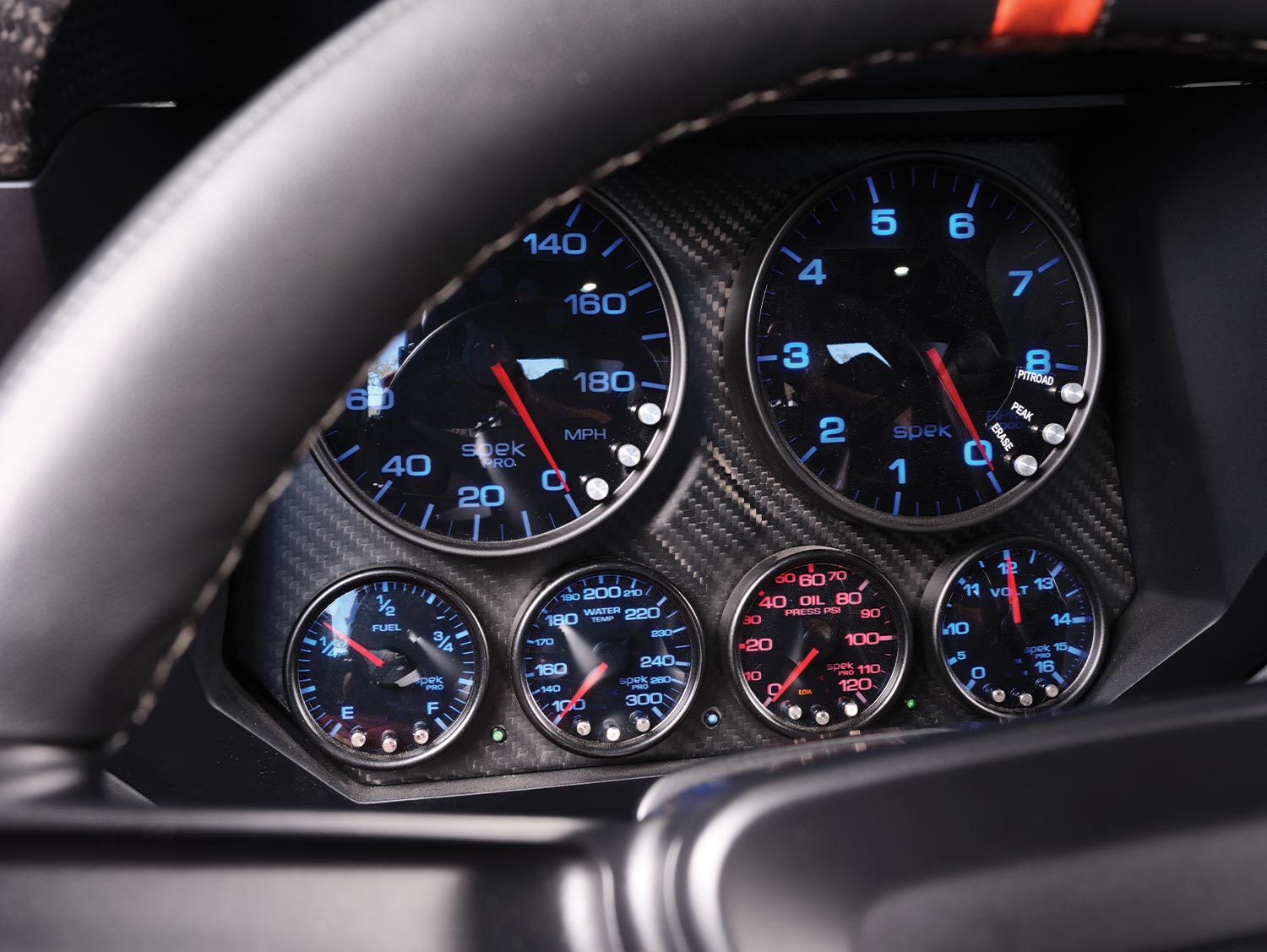 a peep through the steering wheel at the '69 Camaro gauges